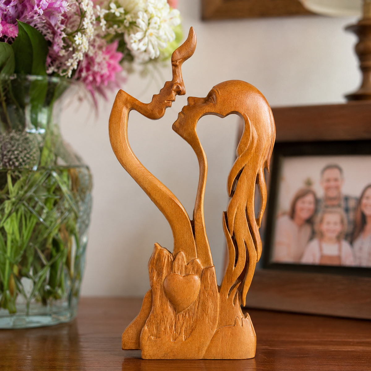 Wood Color wooden couple sculpture in a styled home setting; accessories not included