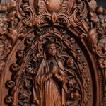 Wood carving of the Virgin Mary in leaves - mokarve