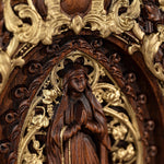 Wood carving of the Virgin Mary in leaves - mokarve