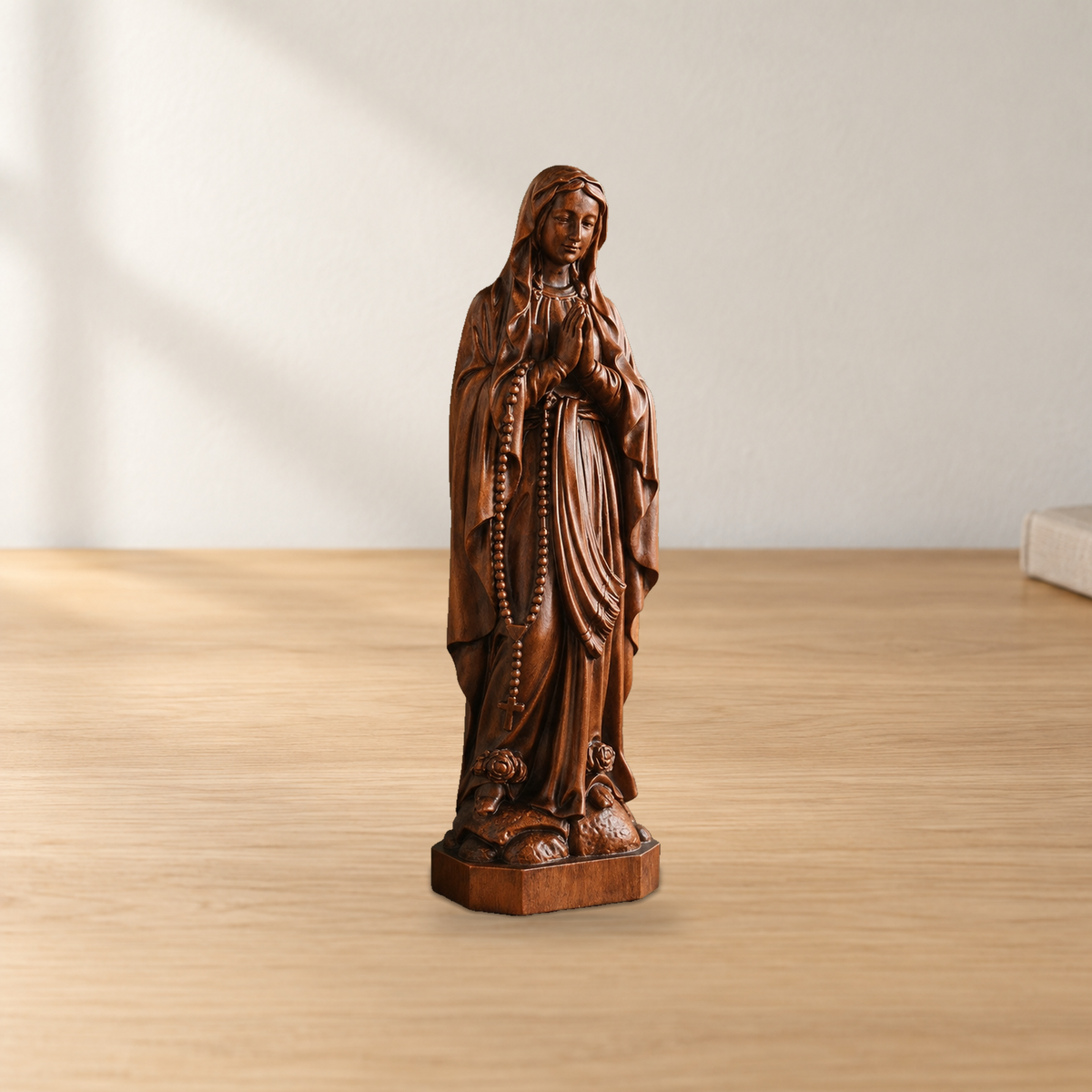 Wooden statue of Our Lady of Lourdes praying